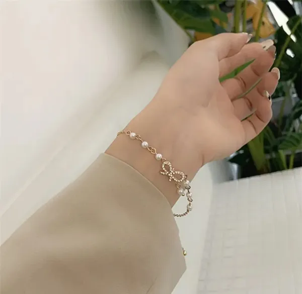 Elegant_Pearl_Bow_Charm_Bracelet