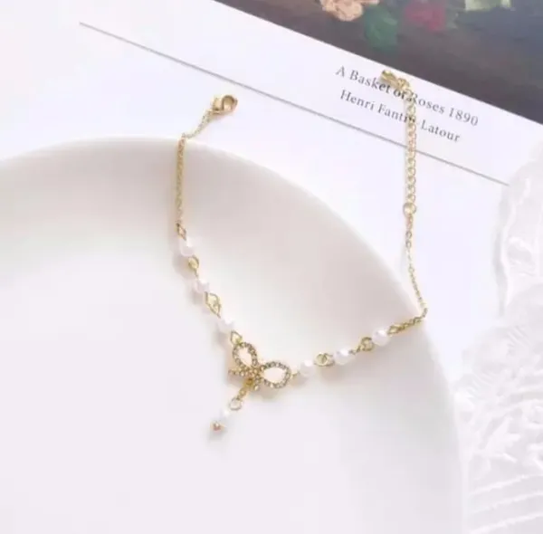 Elegant_Pearl_Bow_Charm_Bracelet