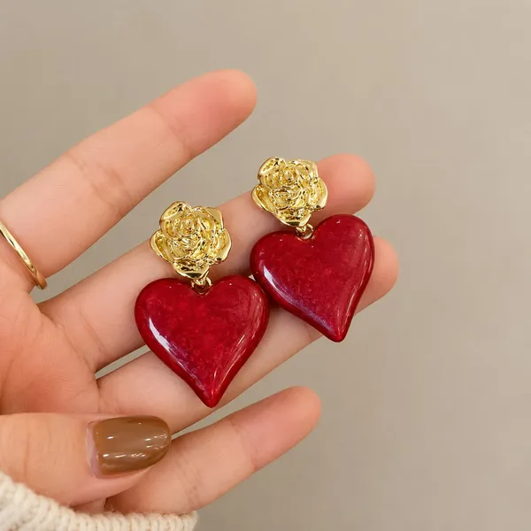 Elegant_Red_Heart_Drop_Earrings_For_Women_Glossy_Heart_Shaped_Design_With_Detailed_Golden_Rose_Studs_Romantic_Trendy_Fashion_Jewellery_For_Party_Date_Night_Festive_And_Special_Occasion_Wear