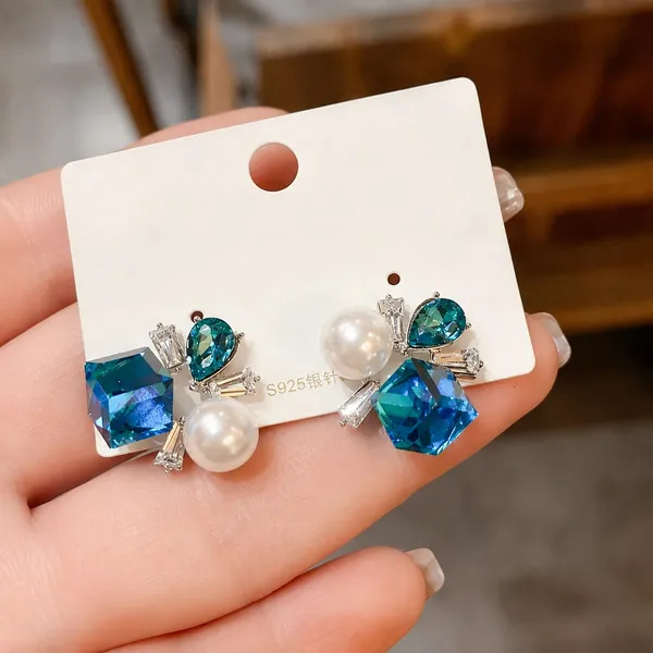Elegant_Blue_Crystal_Pearl_Stud_Earrings_For_Women_Statement_Geometric_Design_With_Teardrop_Gemstones_Sparkling_Cz_Detailing_And_White_Pearl_Accents_Party_Wear_Fashion_Jewellery