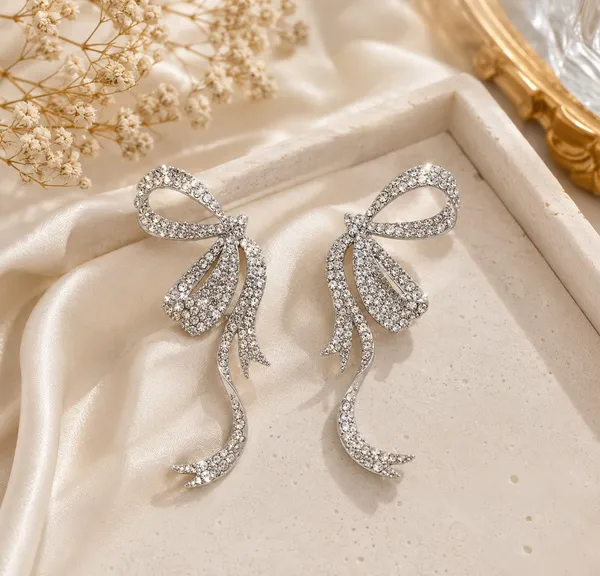 Elegant_Silver_Bow_Crystal_Drop_Earrings_For_Women_Sparkling_Rhinestone_Statement_Jewellery_For_Party_Wedding_Festive_And_Stylish_Special_Occasion_Wear
