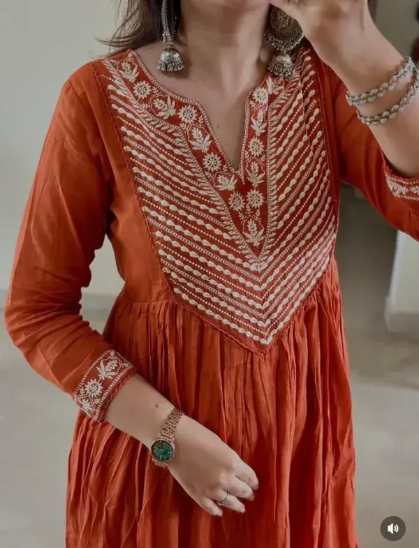Elegant_Rust_Orange_Anarkali_Suit_With_Embroidered_Detailing