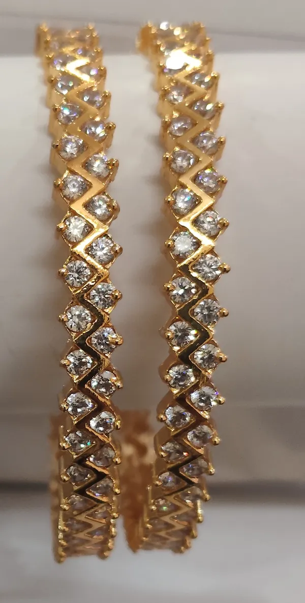 Gold_Plated_Metal_Criss_Cross_White_Stone_Bangles_For_Women