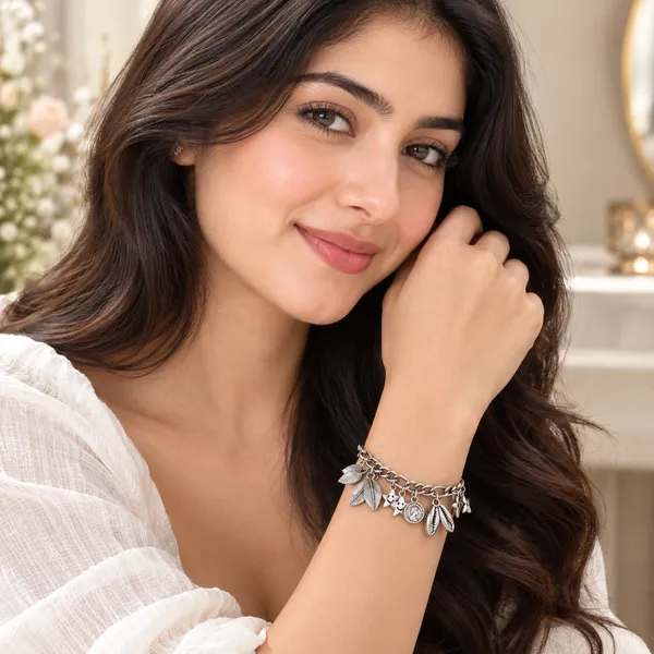 Elegant_Silver_Charm_Bracelet_–_Leaf_&_Floral_Collection