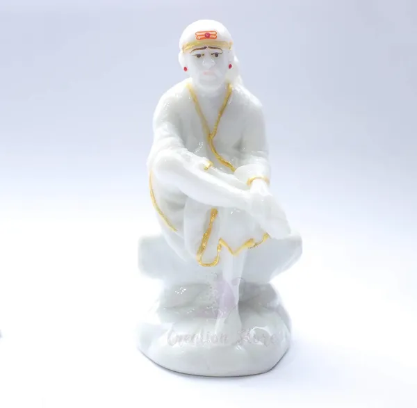 Sai_Baba_Statue_Marble_Dust_Murti_For_Home_Pooja_Car_Dashboard_Sai_Baba_Idol_Handmade_Finishing_Sitting_On_Stone_4_Inch