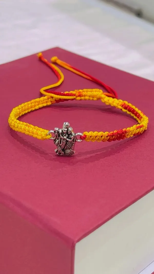 Yellow_Thread_Religious_Charm_Rakhi_for_Brother_-_Pack_of_2