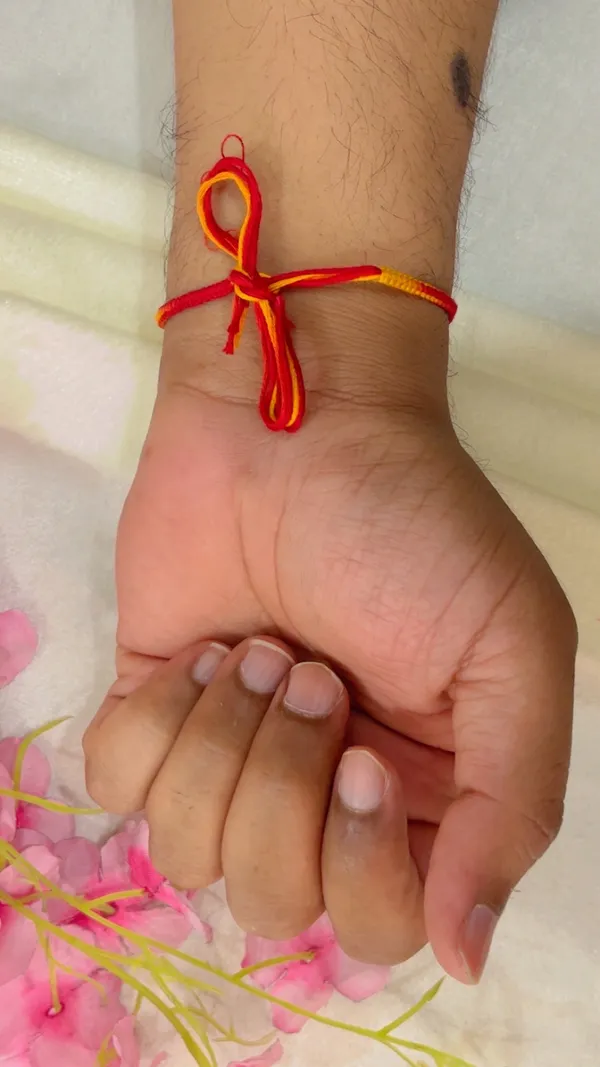 Red_Yellow_Thread_Ganesha_Rakhi_for_Men_-_Pack_of_2