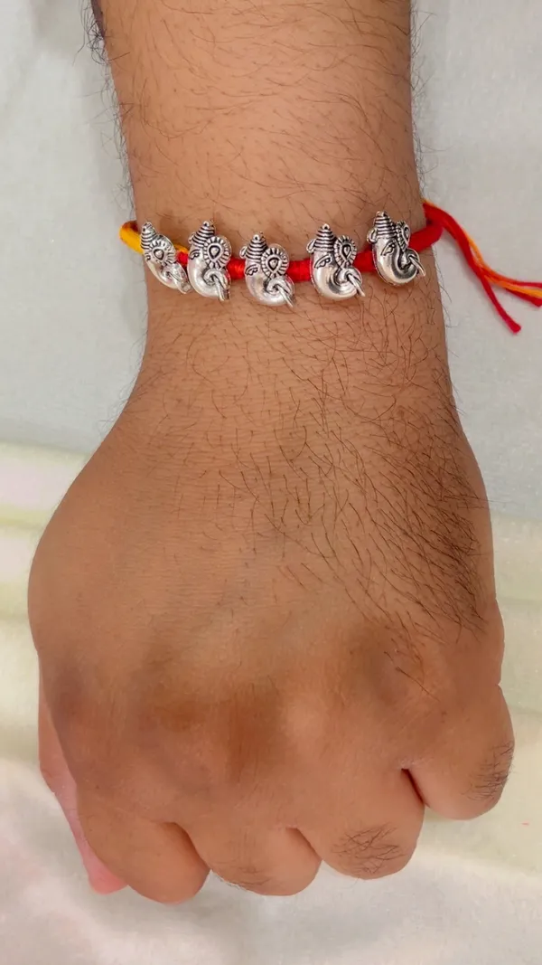 Red_Yellow_Thread_Ganesha_Rakhi_for_Men_-_Pack_of_2