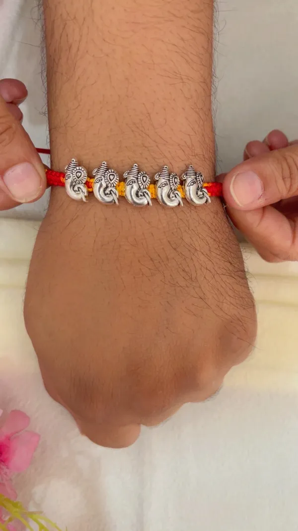Red_Yellow_Thread_Ganesha_Rakhi_for_Men_-_Pack_of_2