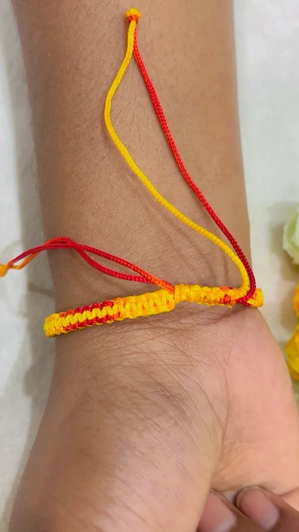 Red_Yellow_Braided_Thread_Rakhi_for_Brothers_-_Pack_of_2