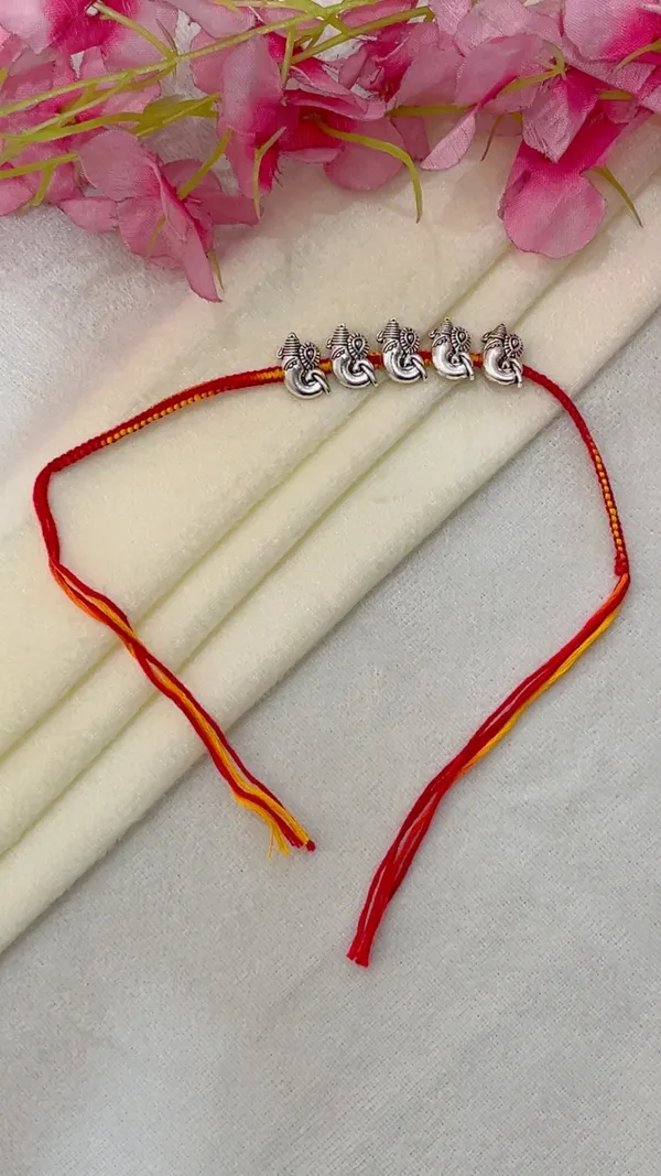 Red_Yellow_Thread_Ganesha_Rakhi_for_Men_-_Pack_of_2