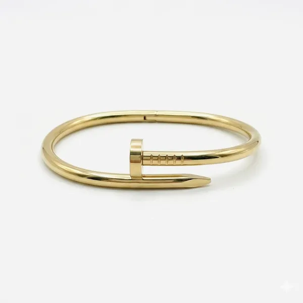 Gold_Stainless_Steel_Nail_Motif_Statement_Bangle_For_Women