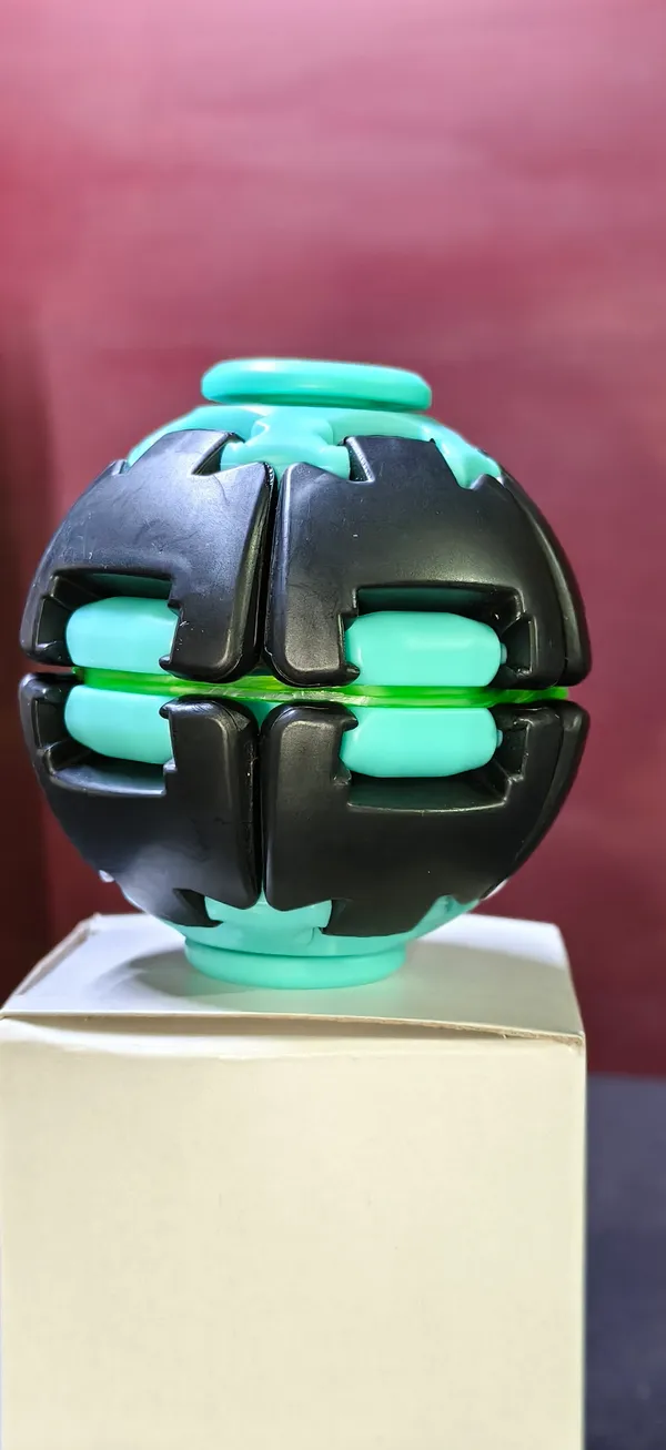 Black_And_Teal_Plastic_Spin_Ball_Toy_For_Kids_Pack_Of_3