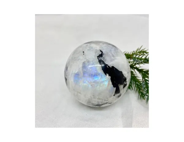 White_Crystal_Sphere_With_Blue_Flash_And_Black_Inclusions