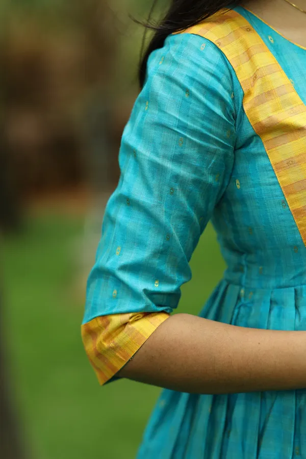 Teal_Blue_Silk_Maxi_Frock_With_Mustard_Border_Elegant_Festive_Wear