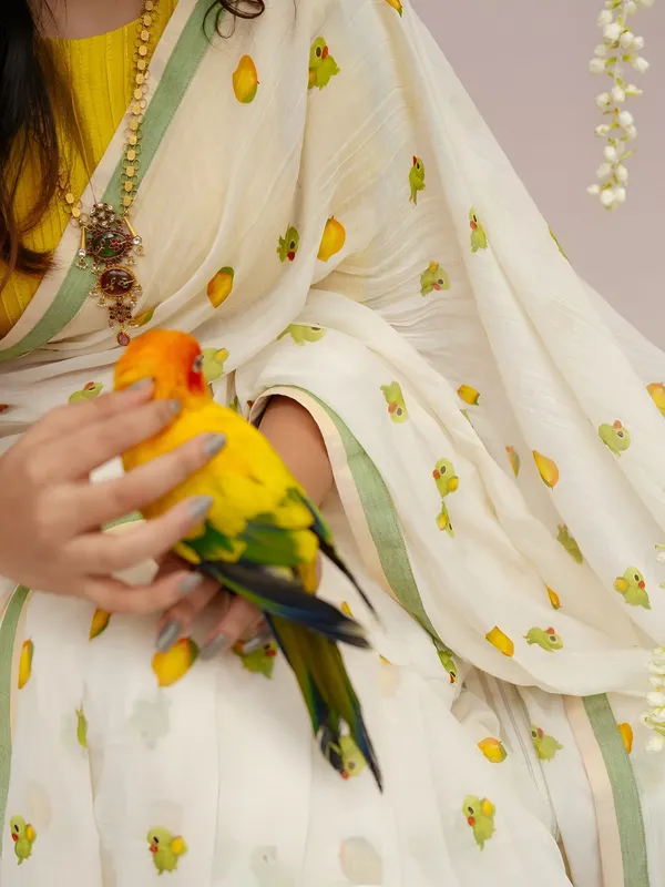 Elegant_Off_White_Linen_Cotton_Saree_With_Parrot_Motif_Pastel_Green_Border