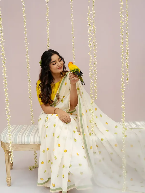 Elegant_Off_White_Linen_Cotton_Saree_With_Parrot_Motif_Pastel_Green_Border
