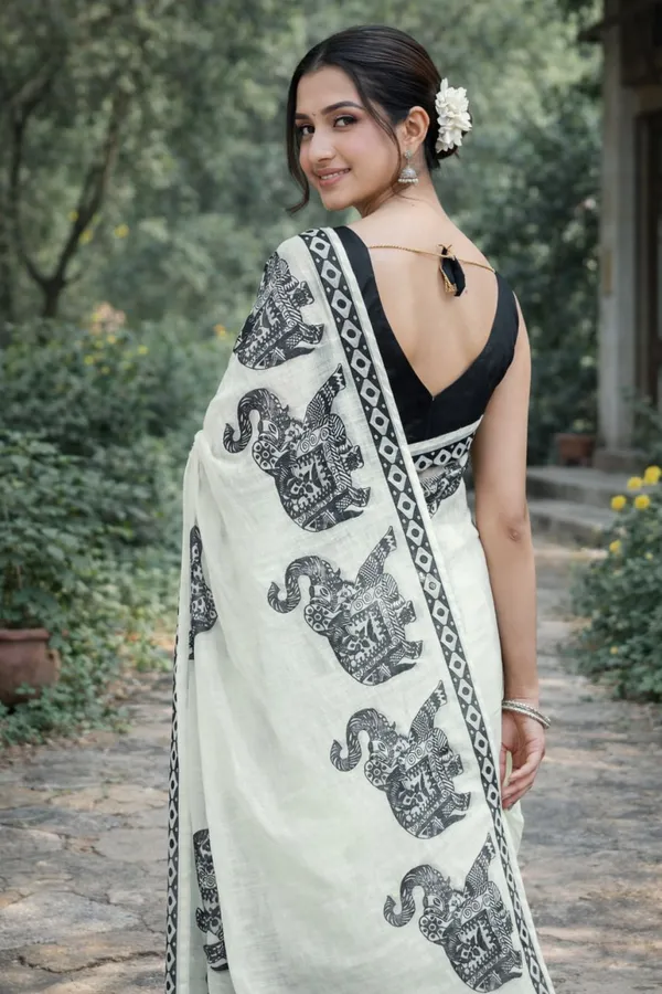 Elegant_Ivory_Linen_Saree_With_Black_Elephant_Print_Border