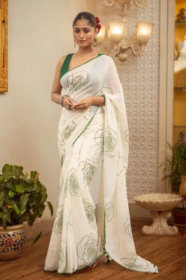 Elegant_White_Saree_With_Green_Floral_Line_Print_Minimal_Border
