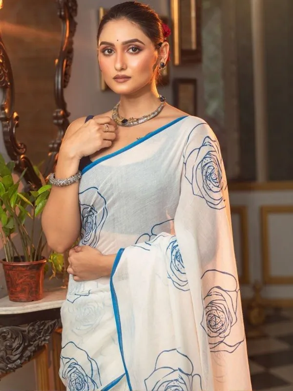 Elegant_White_Saree_With_Blue_Floral_Line_Print_Minimal_Border