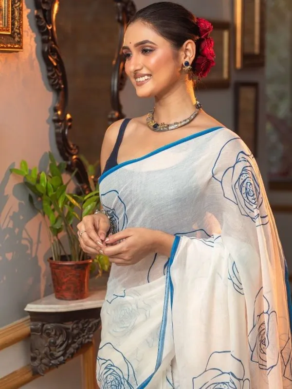 Elegant_White_Saree_With_Blue_Floral_Line_Print_Minimal_Border