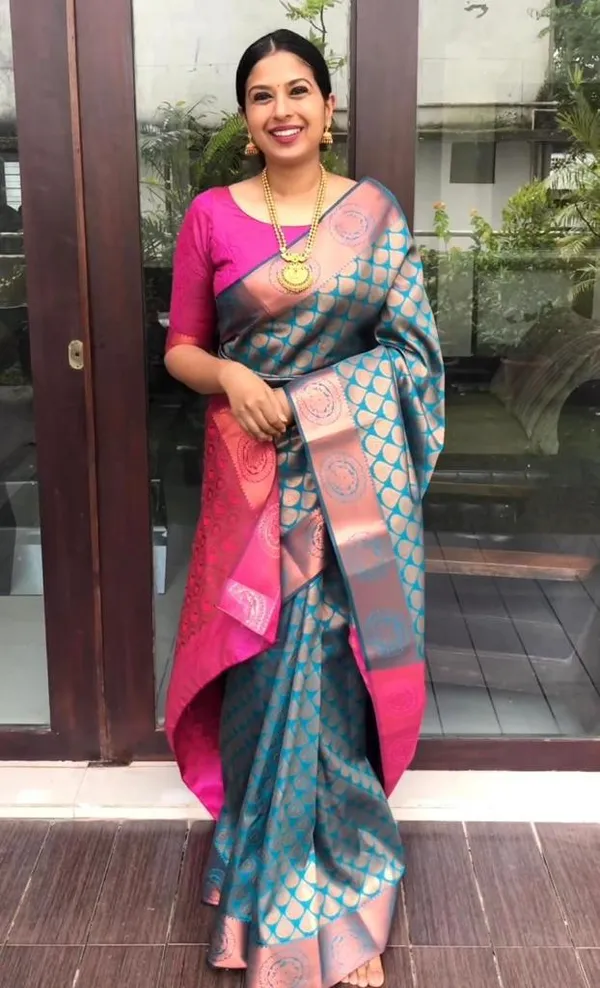 Peacock_Blue_And_Rani_Pink_Silk_Blend_Saree_With_Gold_Woven_Motifs