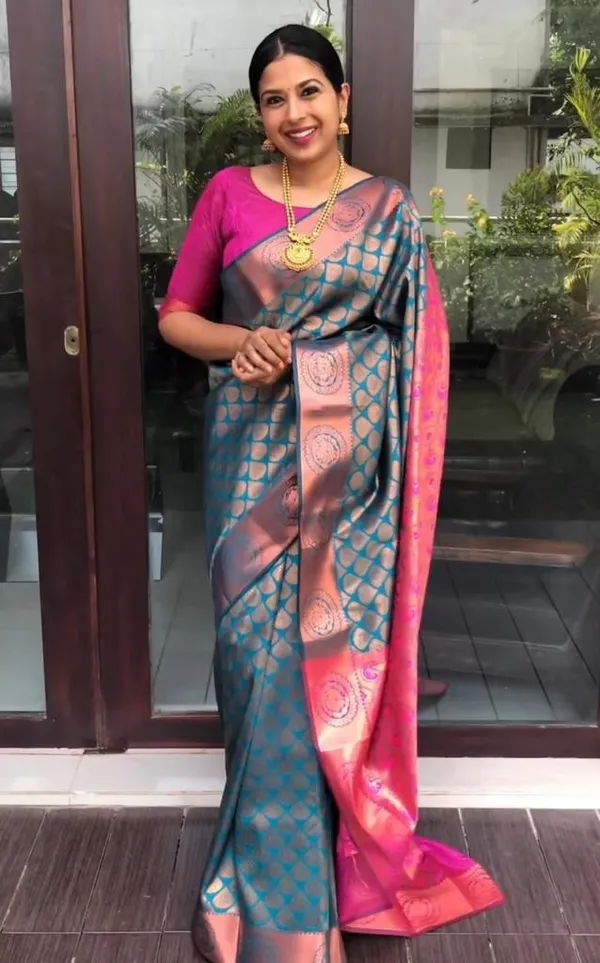 Peacock_Blue_And_Rani_Pink_Silk_Blend_Saree_With_Gold_Woven_Motifs
