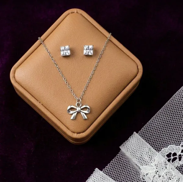 Silver_Tone_Bow_Pendant_Necklace_And_Stud_Earrings_Set_For_Women