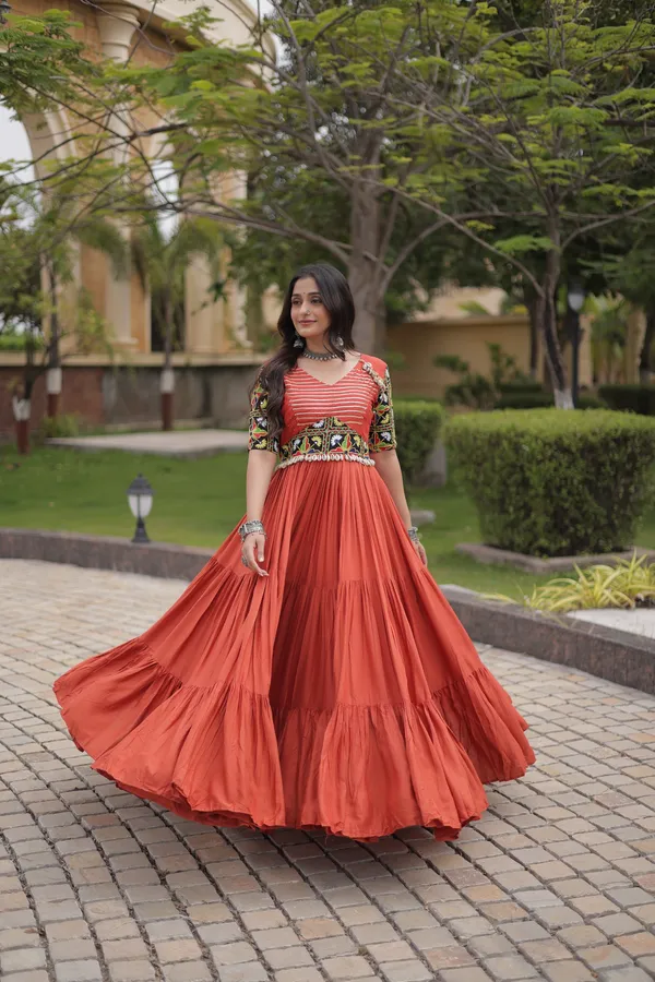Orange_Color_Beautiful_Navratri_Gown_Collection_in_Rayon_Fabric_with_12_Meter_Flair