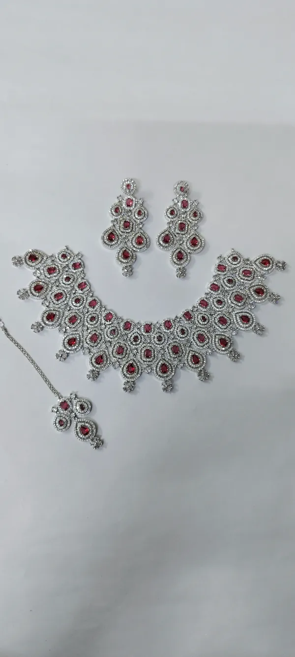 AD_Bridal_Necklace_Set_with_Pink_Ruby_Stones,_Earrings_&_Tika
American_Diamond,_3-Piece_Bridal_Set,_Silver_Tone_Finish,_Matching_Earrings,_Maang_Tika_Included