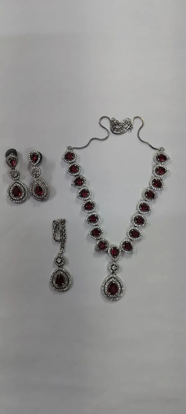 AD_String_Necklace_with_Pink_Ruby_Stones_and_Earrings_Set
Pendant_Style,_Matching_Earrings,_Silver_Tone_Finish,_Teardrop_Stones,