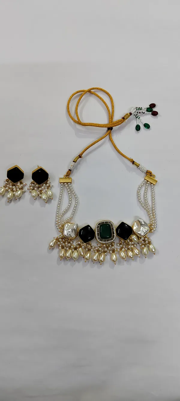 Multi_string_pearl_necklace_with_5_stone_setting_in_mother_of_pearl_and_moissanite_(black_and_green)._Tear_drop_pearl_hangings_and_gold_finish._With_matching_earrings