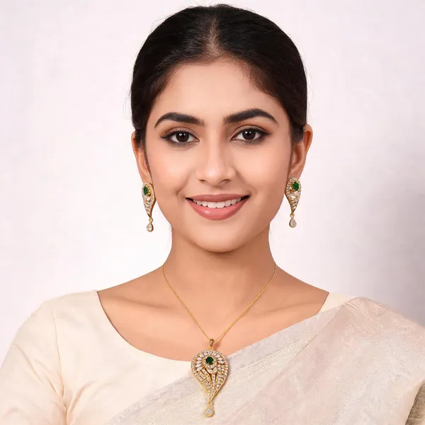Teardrop_Gold_Tone_AD_Pendant_Set_with_Emerald_Stone
Matching_Earrings_Included,_CZ_Stone_Studded,_Floral_Centre_Design,_Drop_Charm_Detail,_Festive_Jewellery_Set
