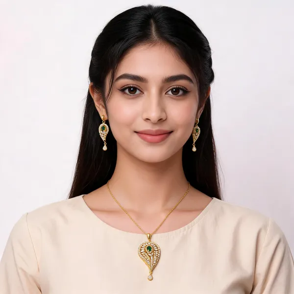 Teardrop_Gold_Tone_AD_Pendant_Set_with_Emerald_Stone
Matching_Earrings_Included,_CZ_Stone_Studded,_Floral_Centre_Design,_Drop_Charm_Detail,_Festive_Jewellery_Set