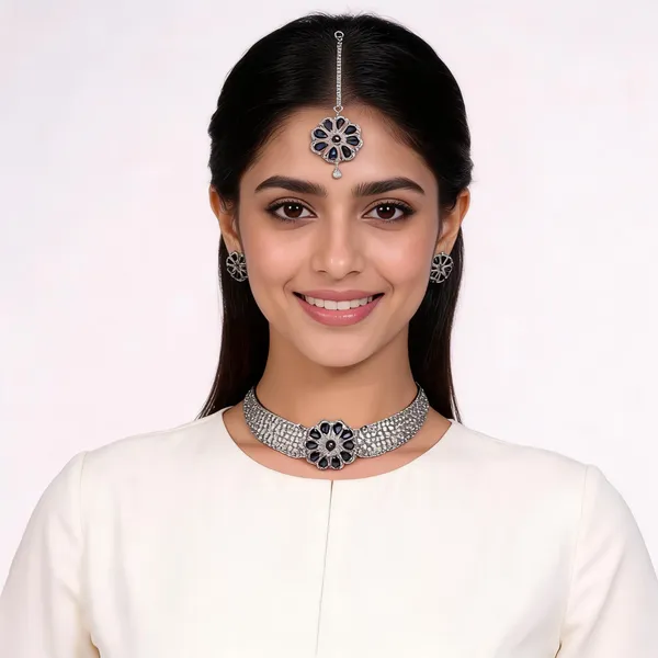 AD_Choker_Necklace_Set_with_Blue_Sapphire_Floral_Detail
Includes_Earrings_&_Tika,_Brooch-Style_Centre,_Silver_Tone_Finish,_Cubic_Zirconia