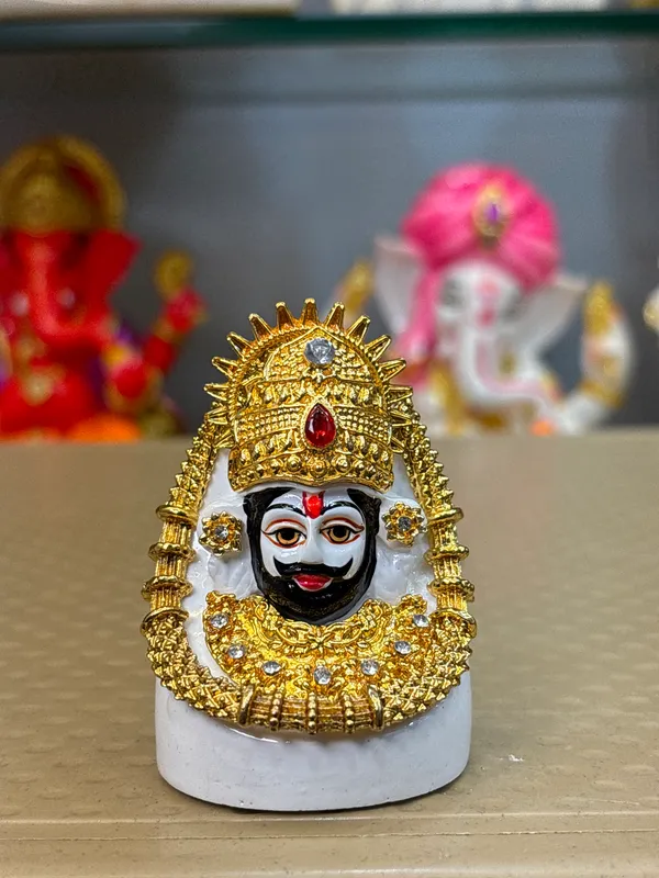 Gold_Tone_Ornate_Hindu_Deity_Figurine_With_White_Base