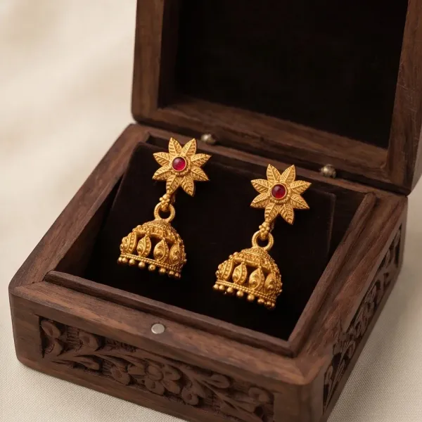Antique_Gold_Floral_Star_Jhumka_Earrings_With_Ruby_Center_Stone