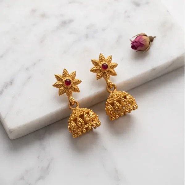 Antique_Gold_Floral_Star_Jhumka_Earrings_With_Ruby_Center_Stone
