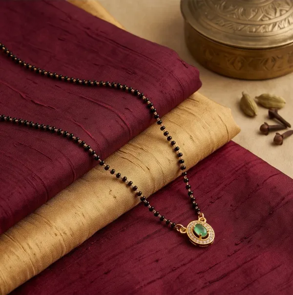 Elegant_Gold_Plated_Emerald_Oval_Pendant_Mangalsutra_With_Cz_Accents
