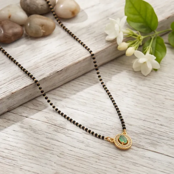 Elegant_Gold_Plated_Emerald_Oval_Pendant_Mangalsutra_With_Cz_Accents