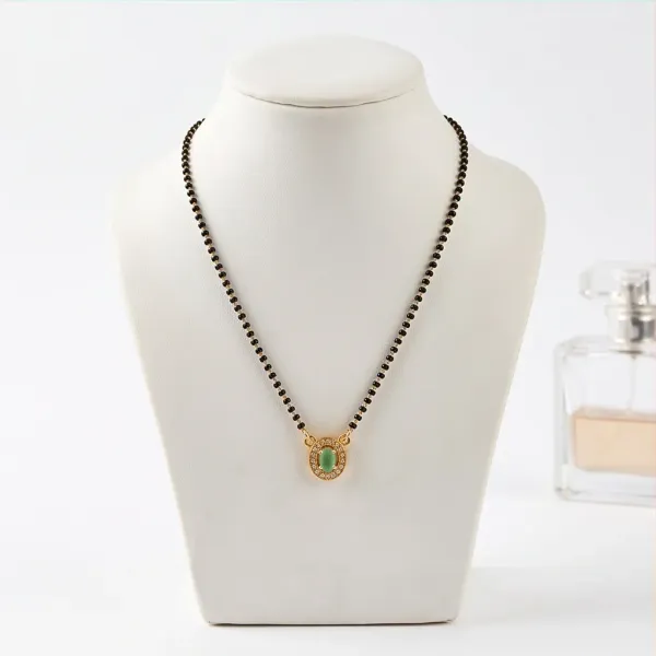 Elegant_Gold_Plated_Emerald_Oval_Pendant_Mangalsutra_With_Cz_Accents