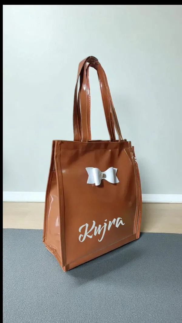 KujrAEnterprise_Stylish_Women’s_Tote_Handbag_with_Bow_Design_|_Glossy_Finish_Shoulder_Bag_Waterproof_Shoulder_Bag_(Brown,_30_L)_-_Pack_of_2