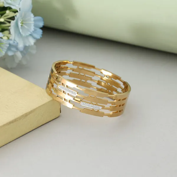 Golden_Geometric_Cutwork_Bracelet_with_Crystal_Detailing