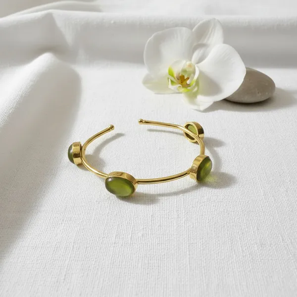Green_Oval_Stone_Gold-Tone_Open_Cuff_Bracelet_for_Women_–_Minimalist_Statement_Bangle
