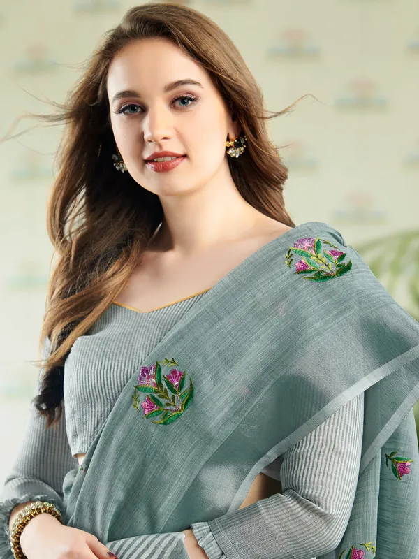 Sea_Green_Linen_Floral_Embroidery_Tassel_Saree_For_Women