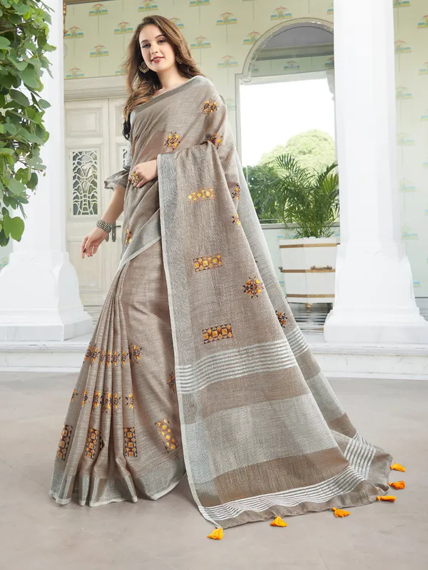 Brown_Linen_Floral_Embroidery_Border_Tassel_Saree_For_Women