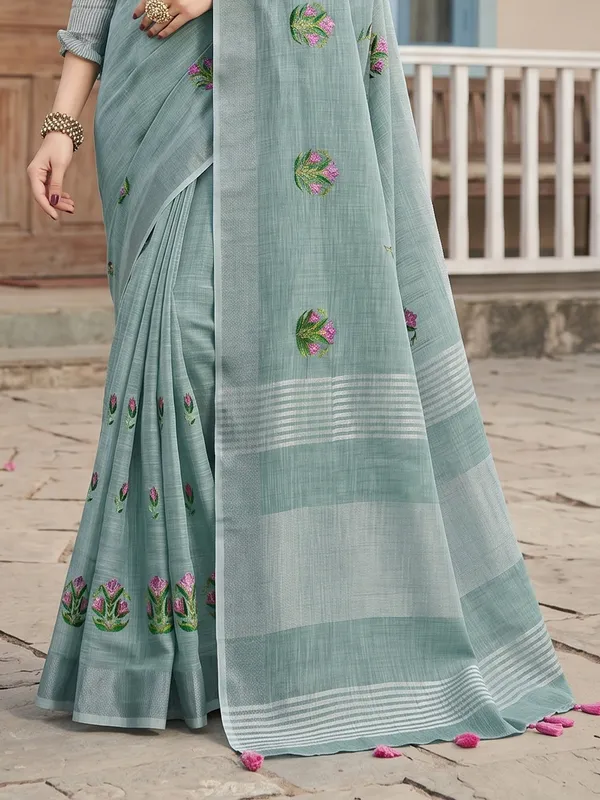 Sea_Green_Linen_Floral_Embroidery_Tassel_Border_Saree_For_Women