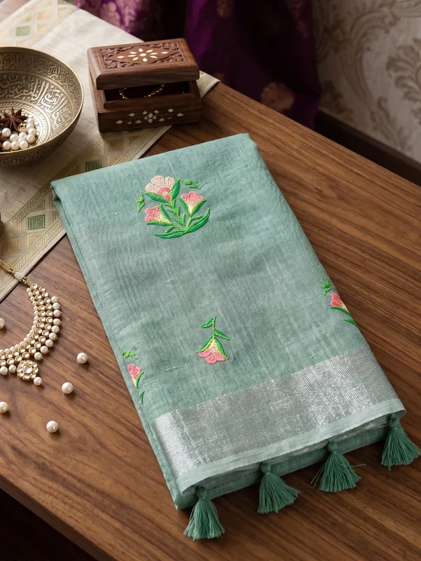 Sea_Green_Linen_Floral_Embroidery_Tassel_Border_Saree_For_Women