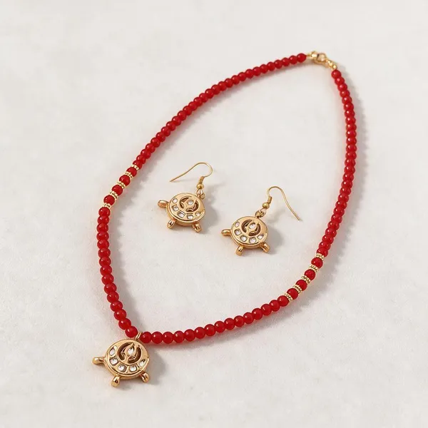 Red_Beaded_Gold_Tone_Cutwork_Pendant_Necklace_And_Earrings_Set_For_Women