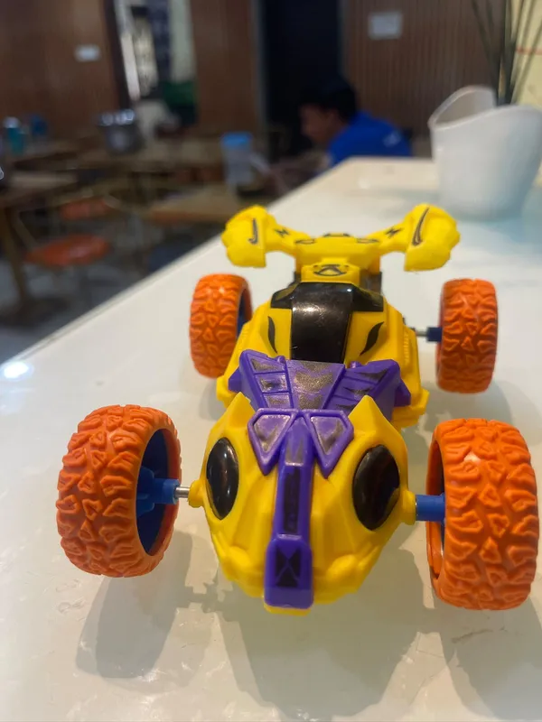 Yellow_Purple_Four_Wheel_Stunt_Toy_Car